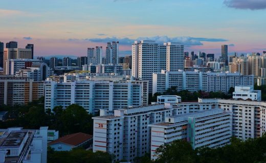 city skyline under cloudy sky during daytime